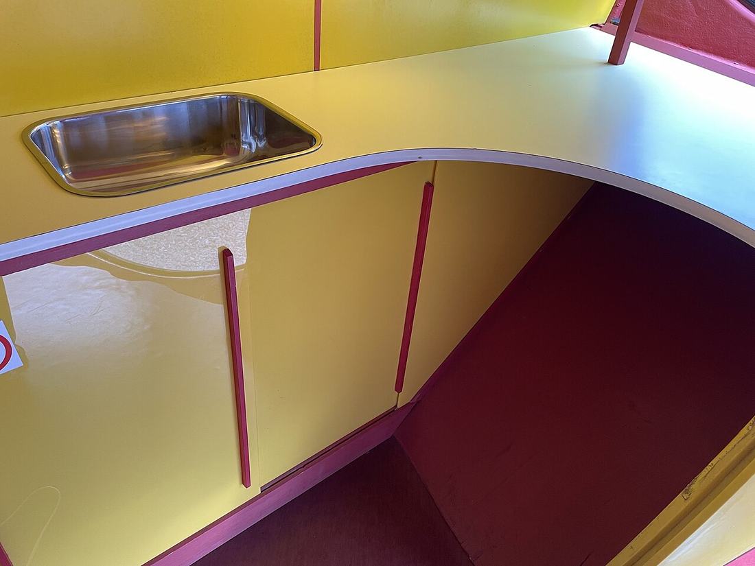 A kitchen area with a table